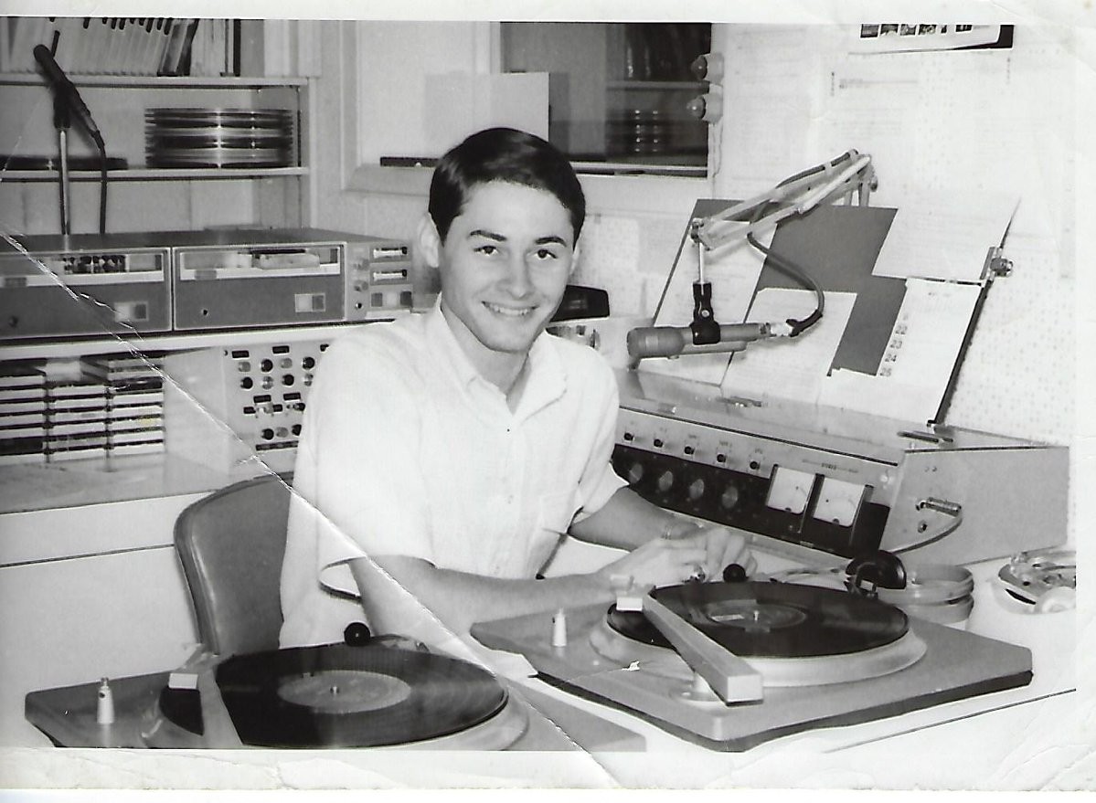 A young Leon works at the Victoria radio station