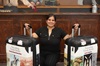Claudia Mosely with two traveling trunks