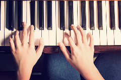 Hands on Piano Keys