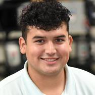 Instrumentation Student smiling in white shirt