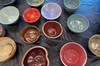 An assortment of colorful handmade bowls on a table