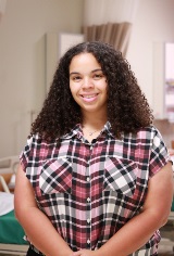 Dr Shenell Wood smiles in a classroom clinic at Victoria College