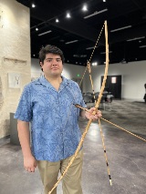 Emilia Vargas with replica bow and arrows