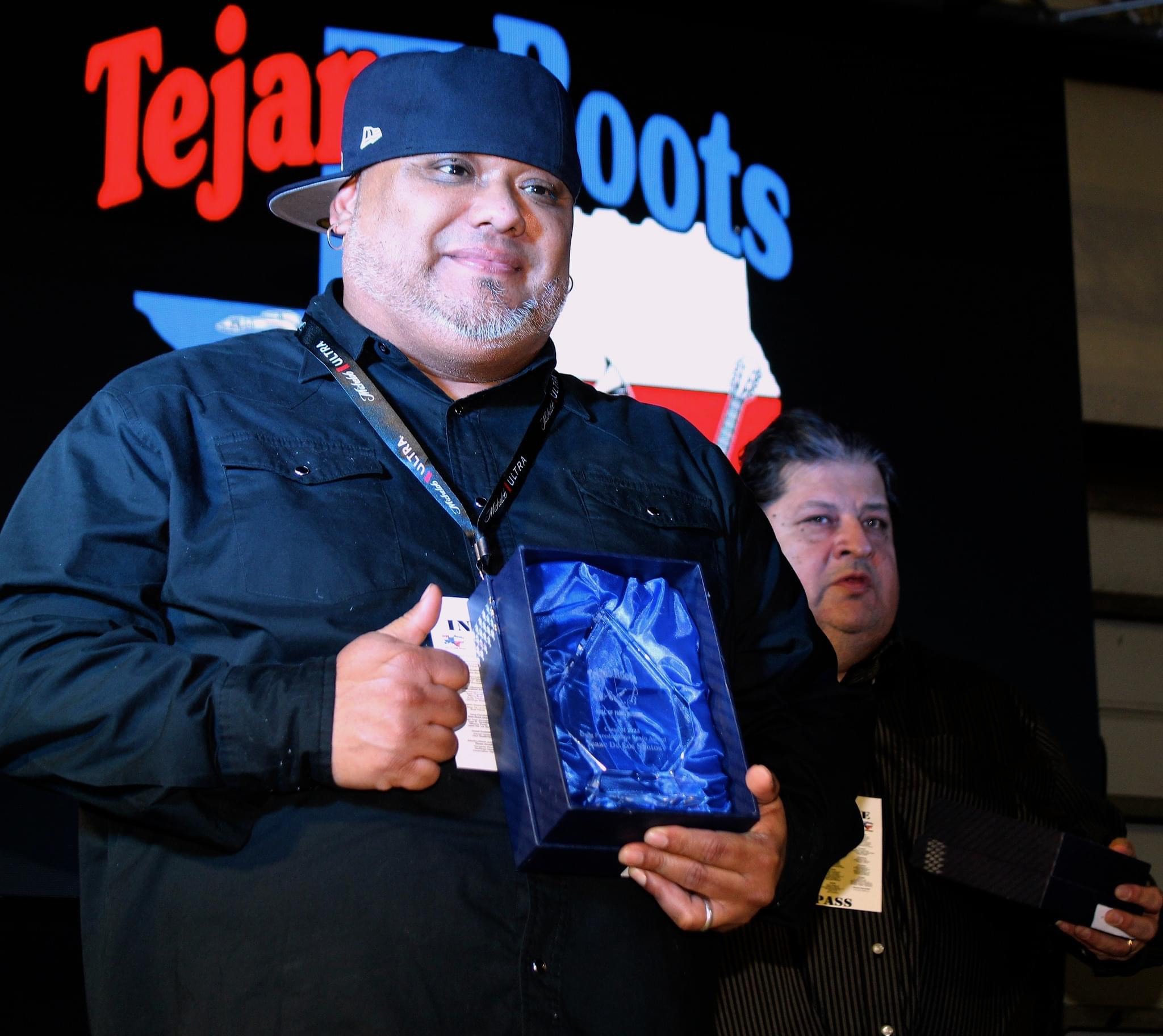 Isaac holds his award at the 2023 Tejano Roots Hall of Fame