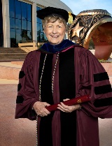 Jo Anne Settles with her doctorate degree from Texas A&M