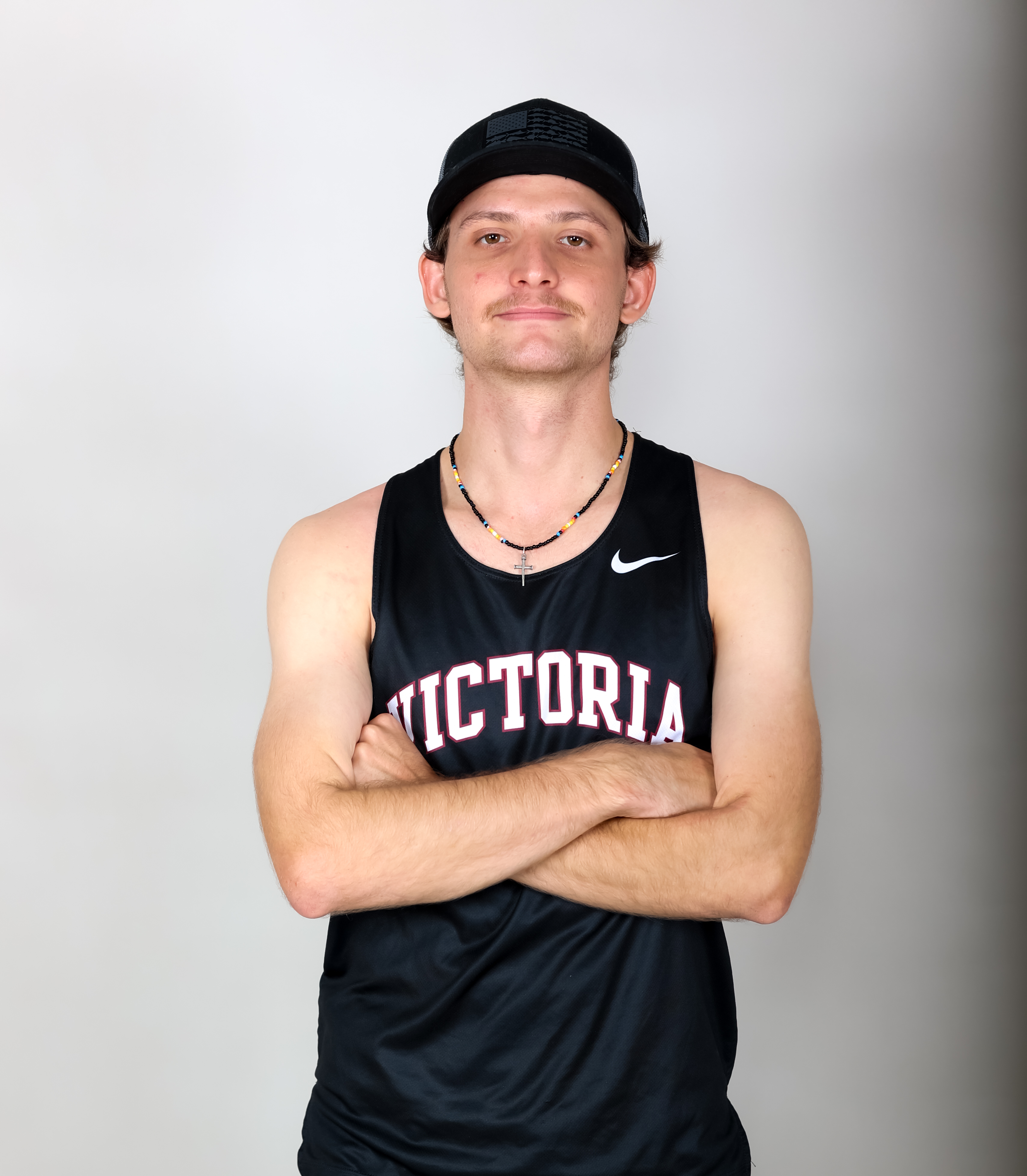 Max Barnett with arms crossed in a black VC uniform