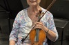 Nina Mavrinac holds her violin