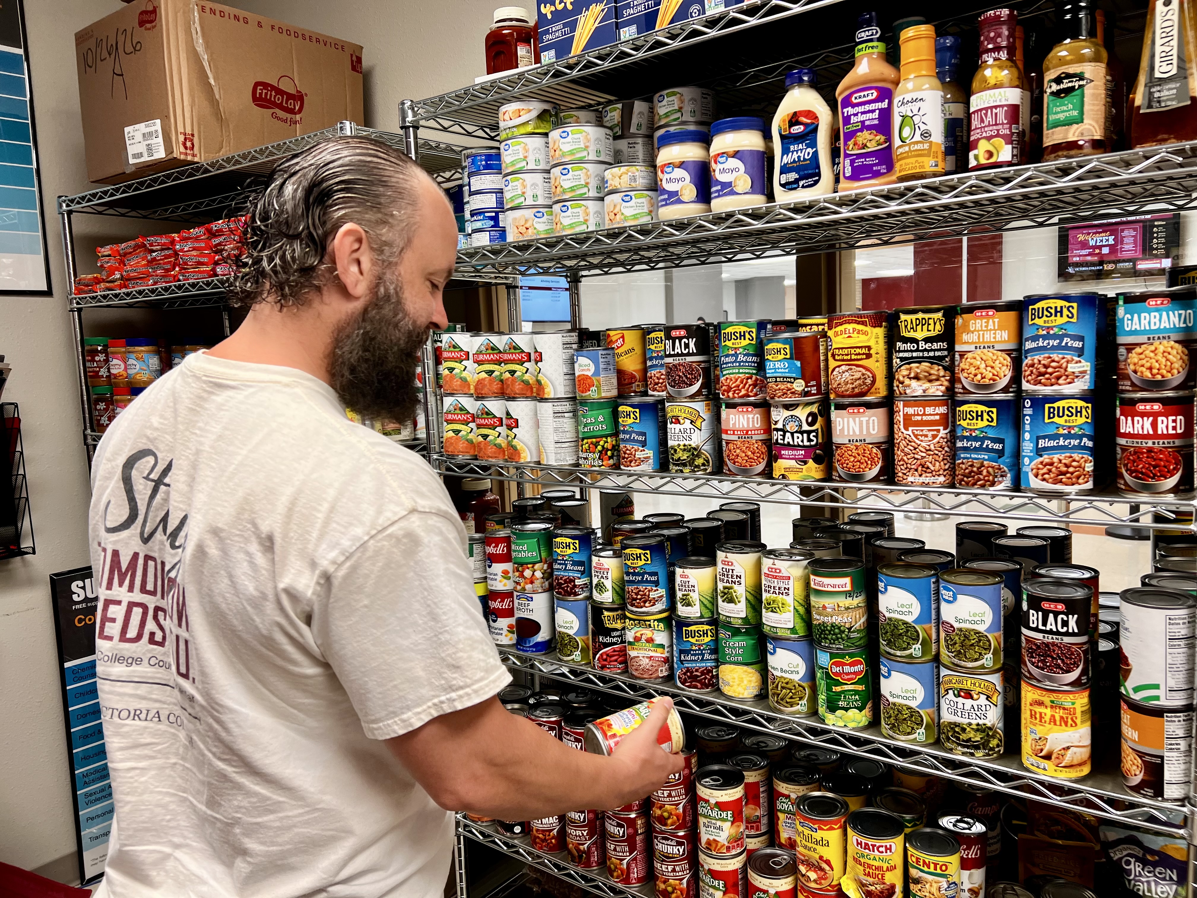 Thomas grabs a can off the Pirate Pantry shelves