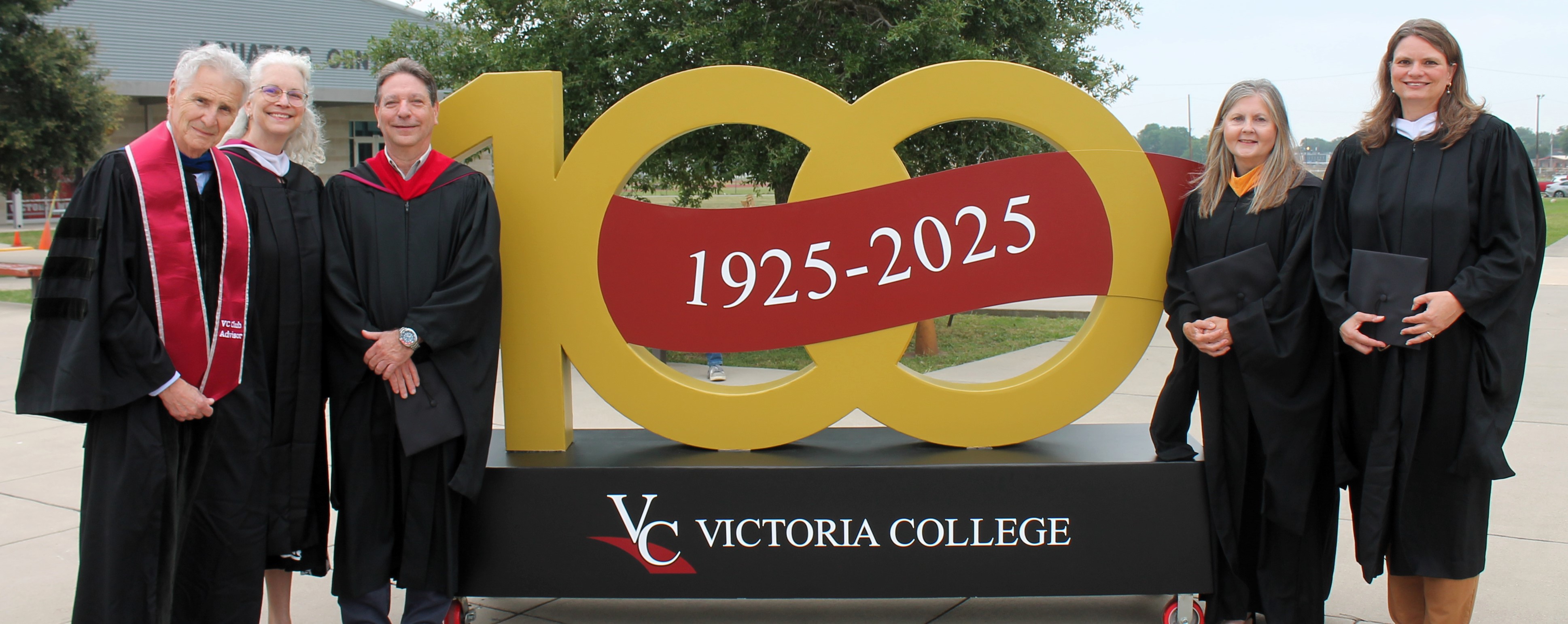 VC's 2025 faculty emeriti pose beside the 100 year statue