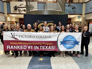 VC Nursing Faculty and Staff hold the new banner honoring the ADN program's #1 ranking