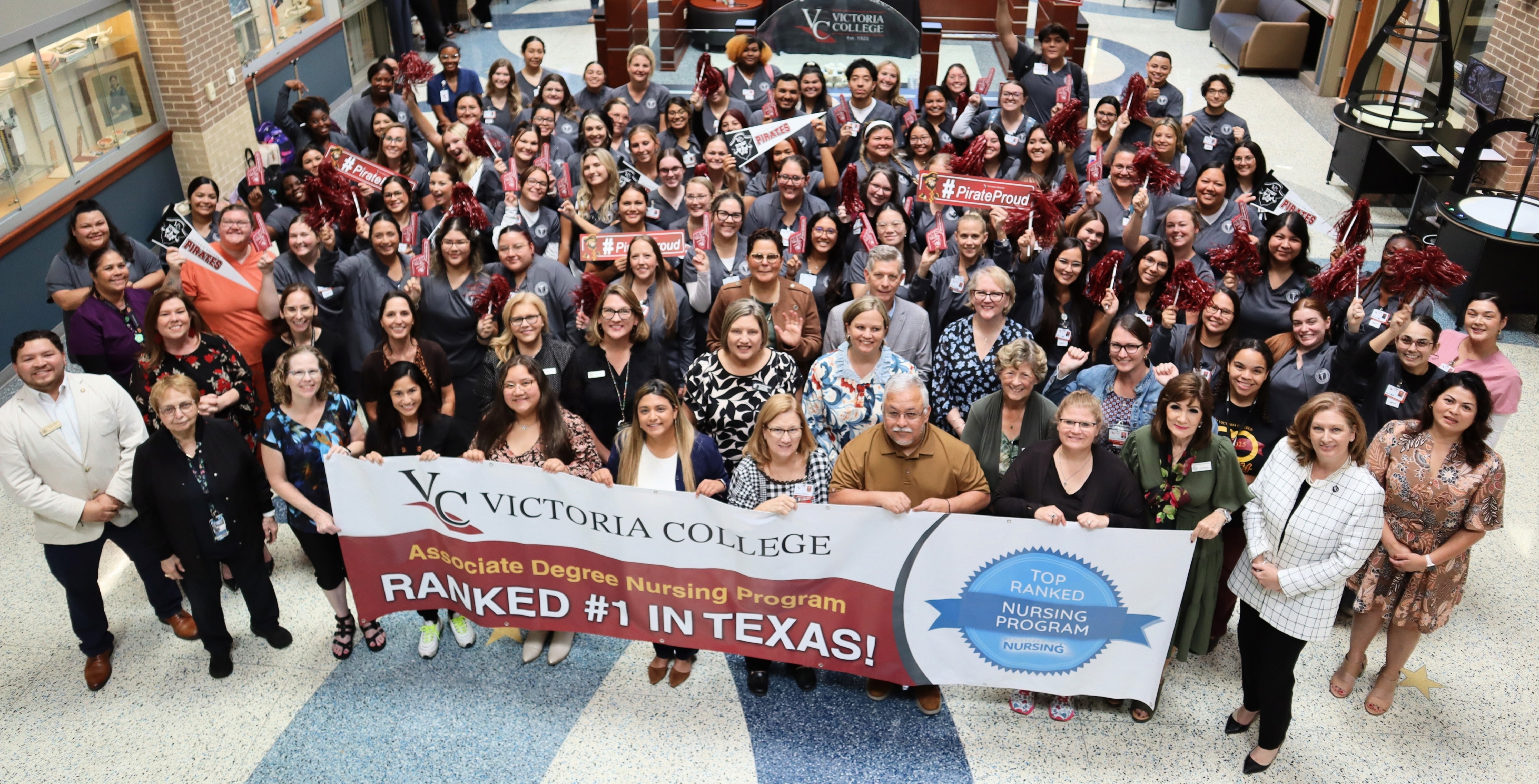 VC nursing students, faculty, staff, alumni and administrators hold a ranked #1 banner