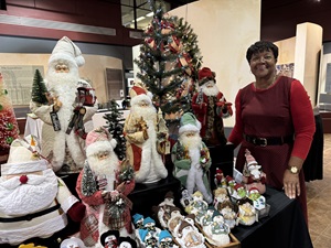 Vendor at the 2024 Artisan's Market selling santas