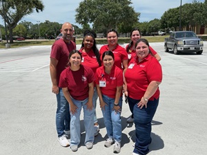 Victoria College and Driscoll Health Plan team members smiling in parking lot after the event