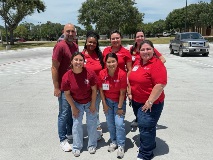 Victoria College and Driscoll Health Plan team members smiling in parking lot after the event