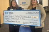 Victoria College rep accepts a grant check