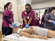 Vocational Nursing students practice chest compressions